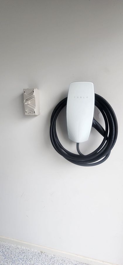 EV charger installed on a garage wall
