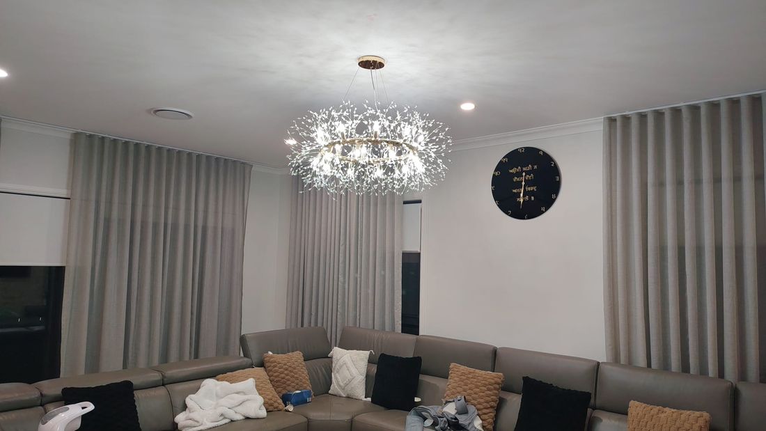 Crystal chandelier installed in a living room